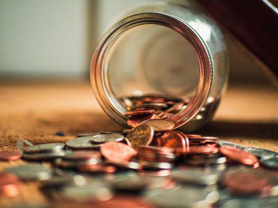 jar of coins, tipped over jar of coins